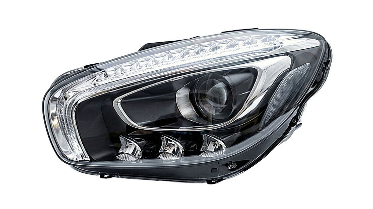 Clear vehicle headlight with LED elements and a projection‑capable main lens