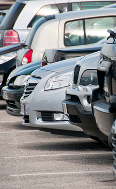 Row of parked cars in a parking lot